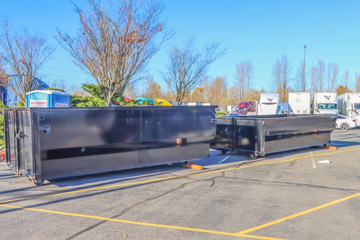 Professional dumpster rental service with roll-off container on residential driveway in Mundelein